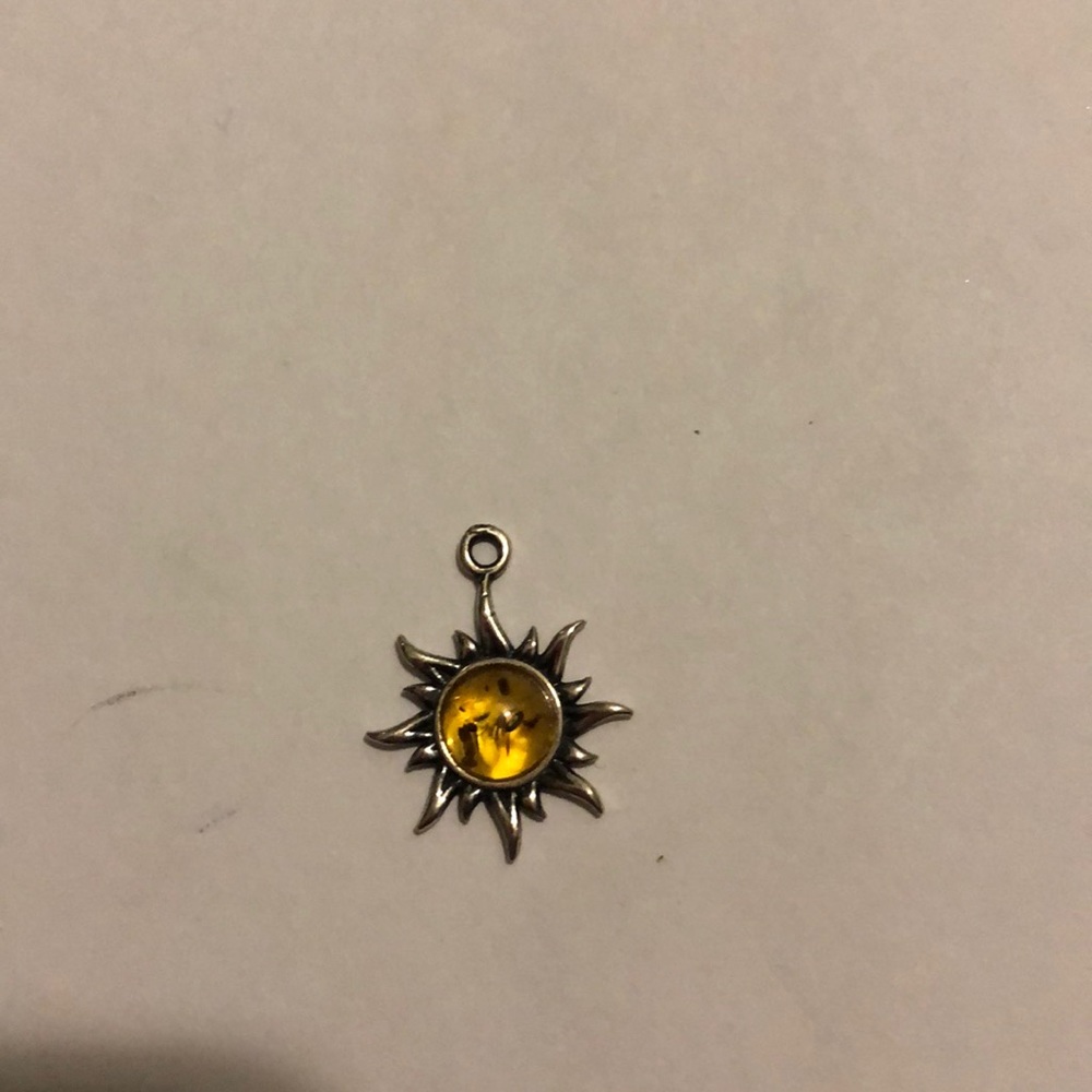 Aesthetically pleasing necklace charm sun